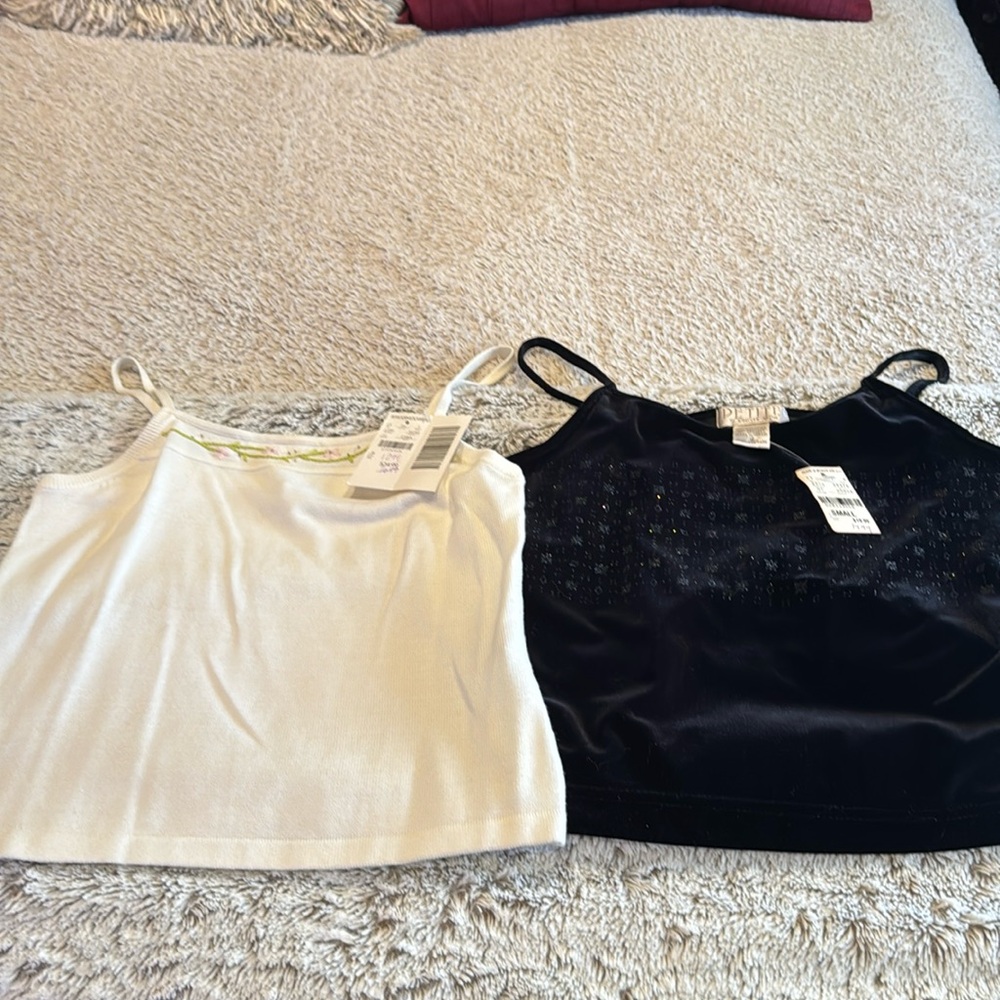2 ladies unworn camisoles by petite sophisticate. white is a p. The black is a S